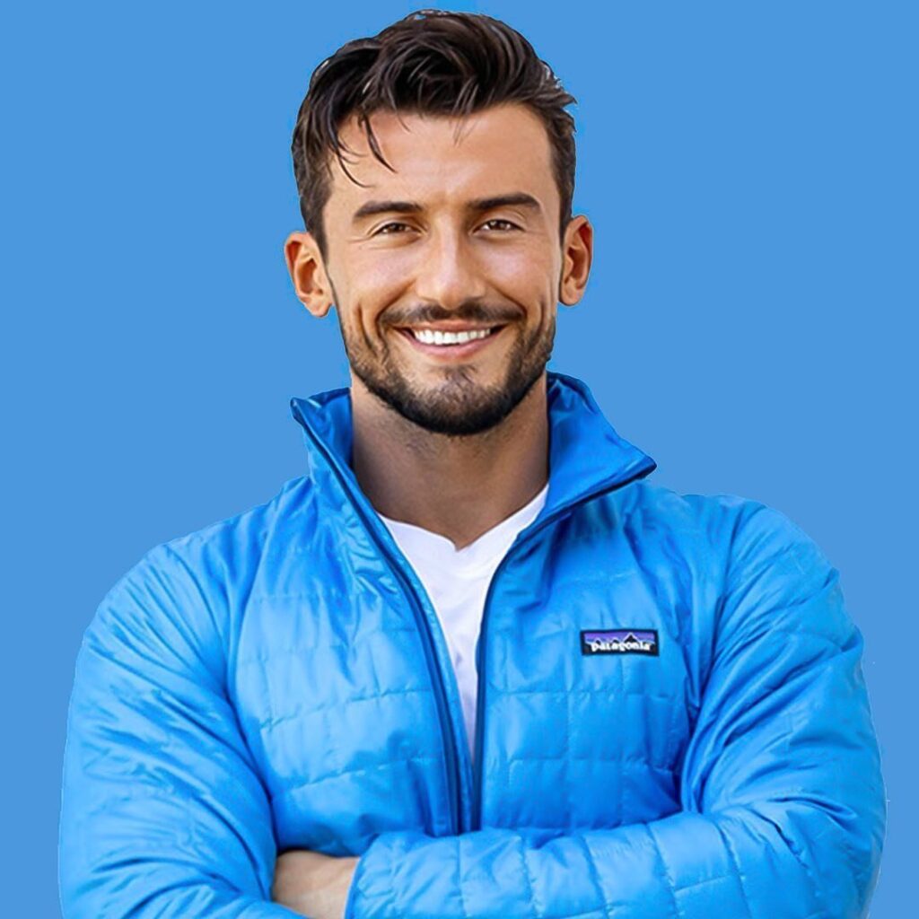 Fitness trainer smailnow smiling in a blue jacket