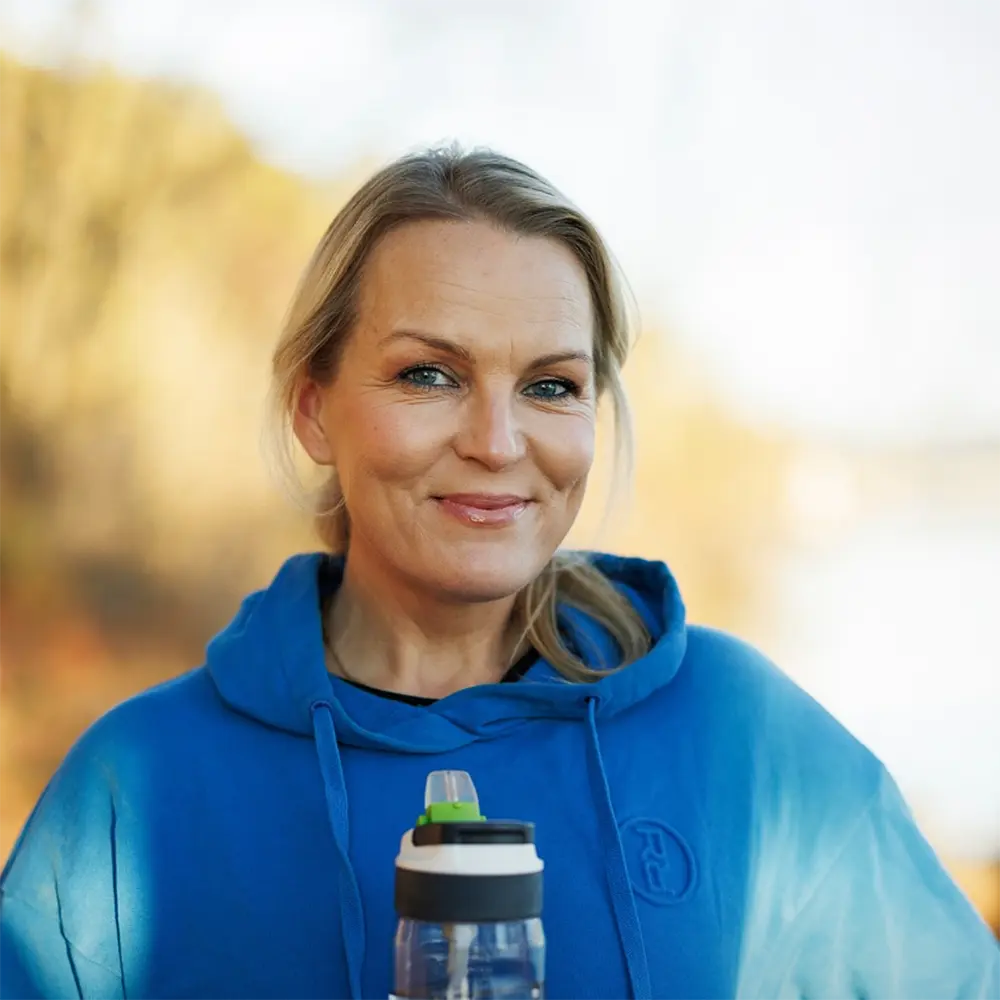 Coach guiding a client in person – exploring the journey from physical to digital coaching.