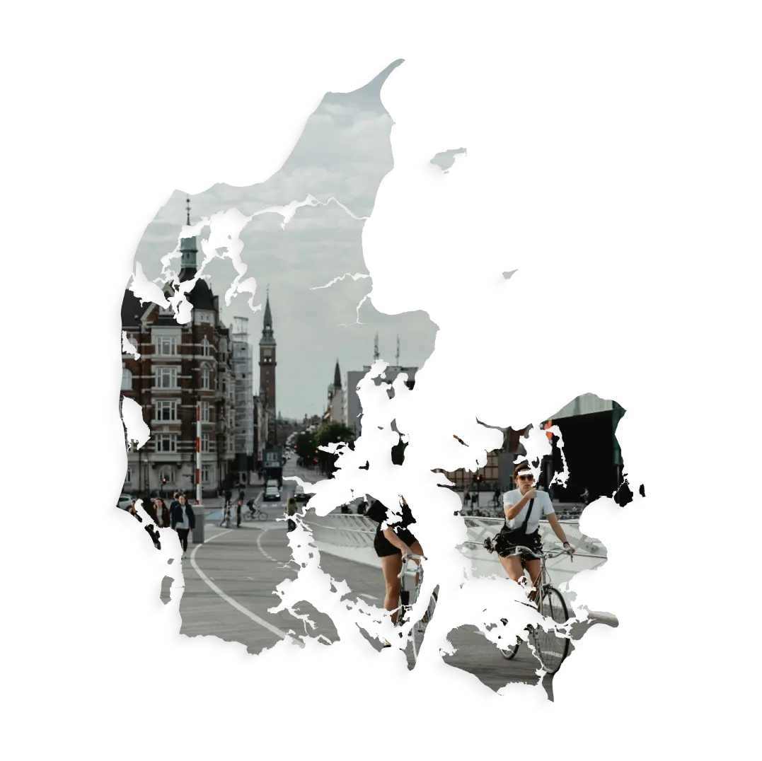 Aerial view of Denmark featuring the bustling streets and iconic architecture of Copenhagen in the background showcasing the CoCoach presence in Denmark.